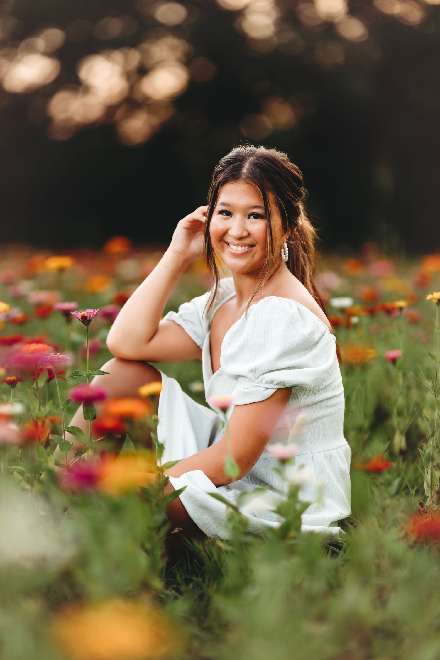 Portrait session in white dress among colorful wildflowers. Middle TN senior photographer
