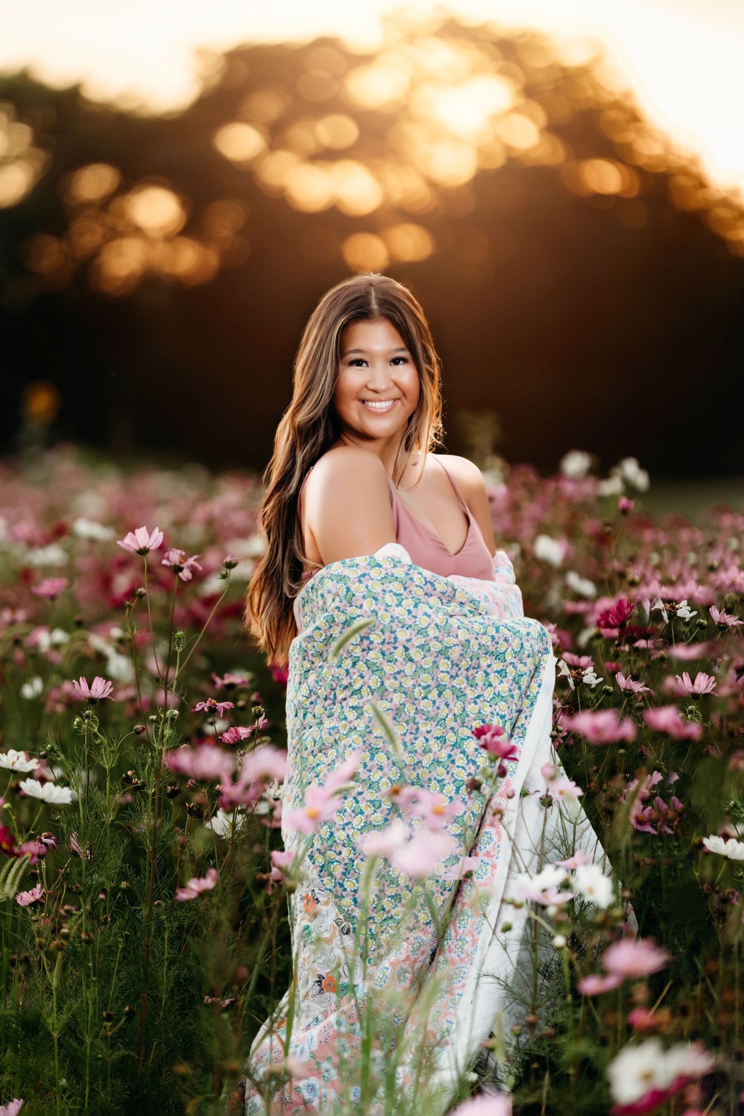 Sunset portrait session in floral dress among pink cosmos flowers. Middle TN senior photographer