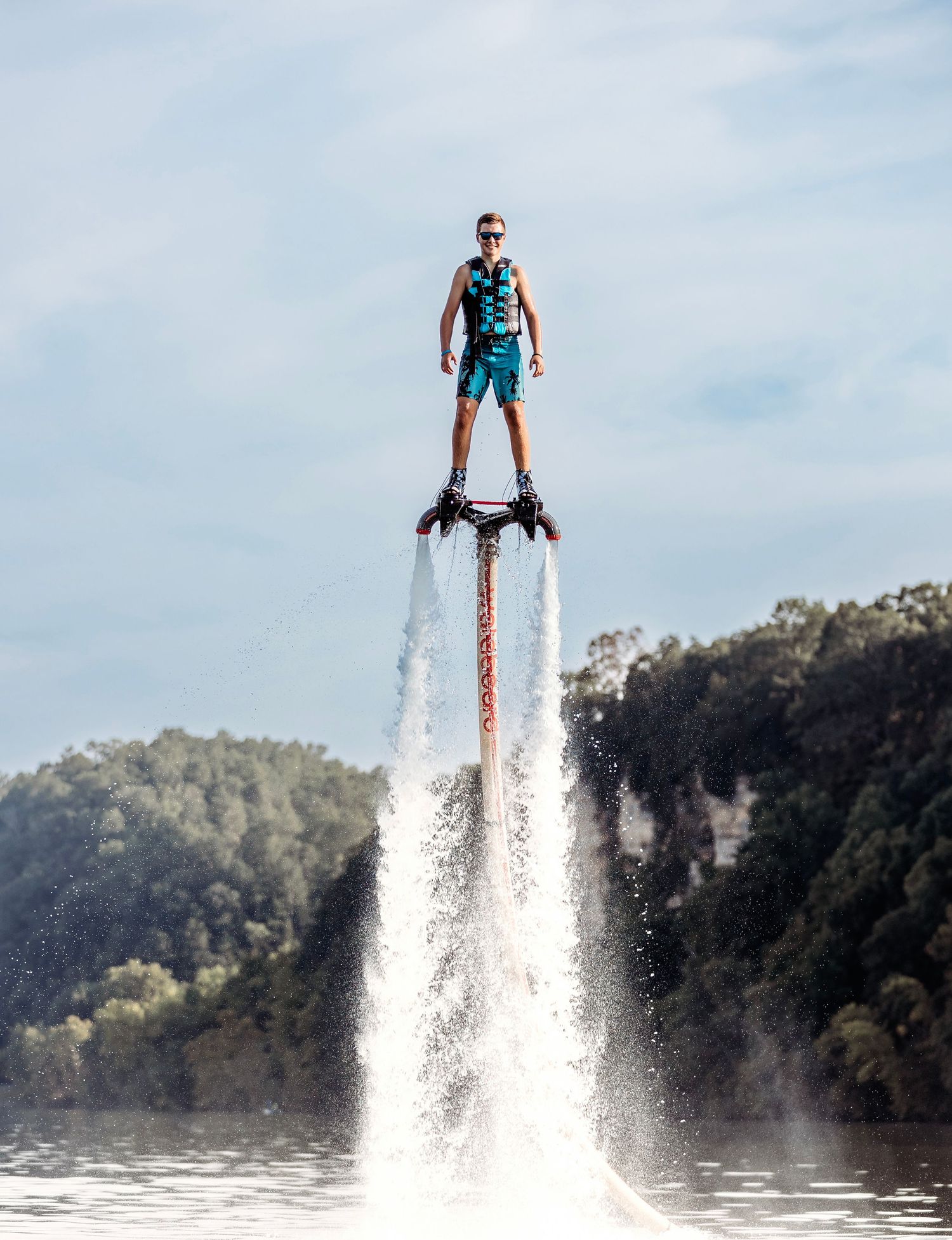 Action shots of senior guy hovering high above water on a hydroflight device. Middle TN senior photographer