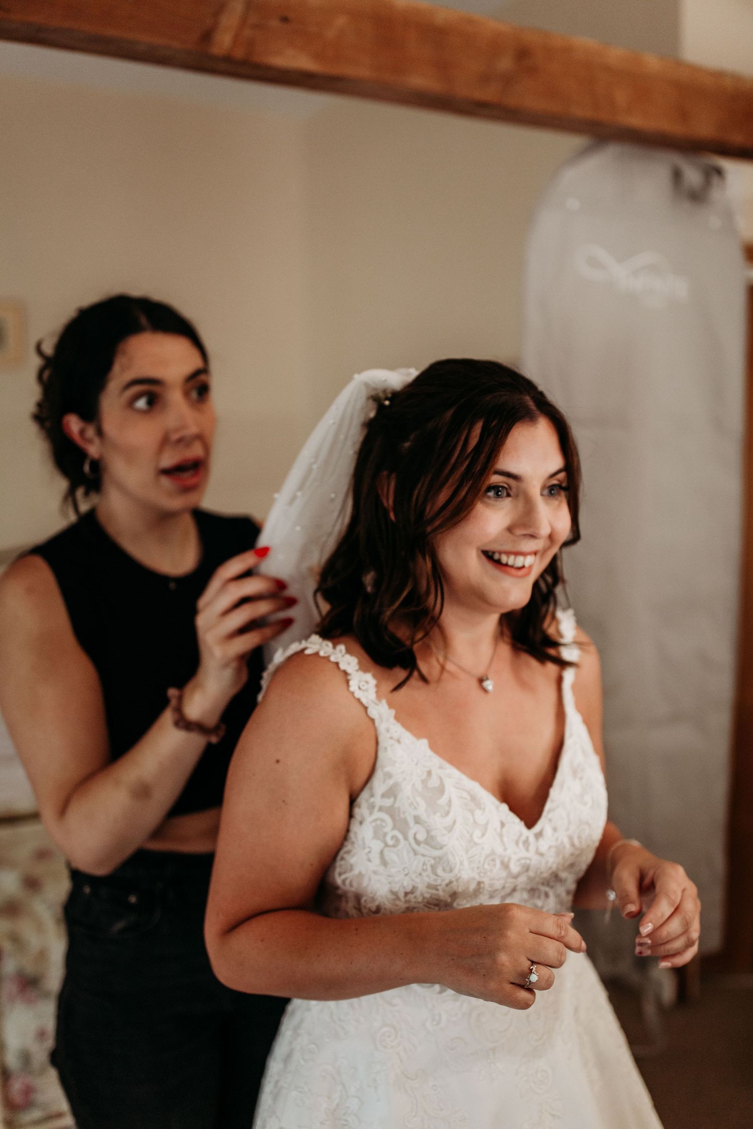 Final touches being made to bridal preparations in rustic room setting.