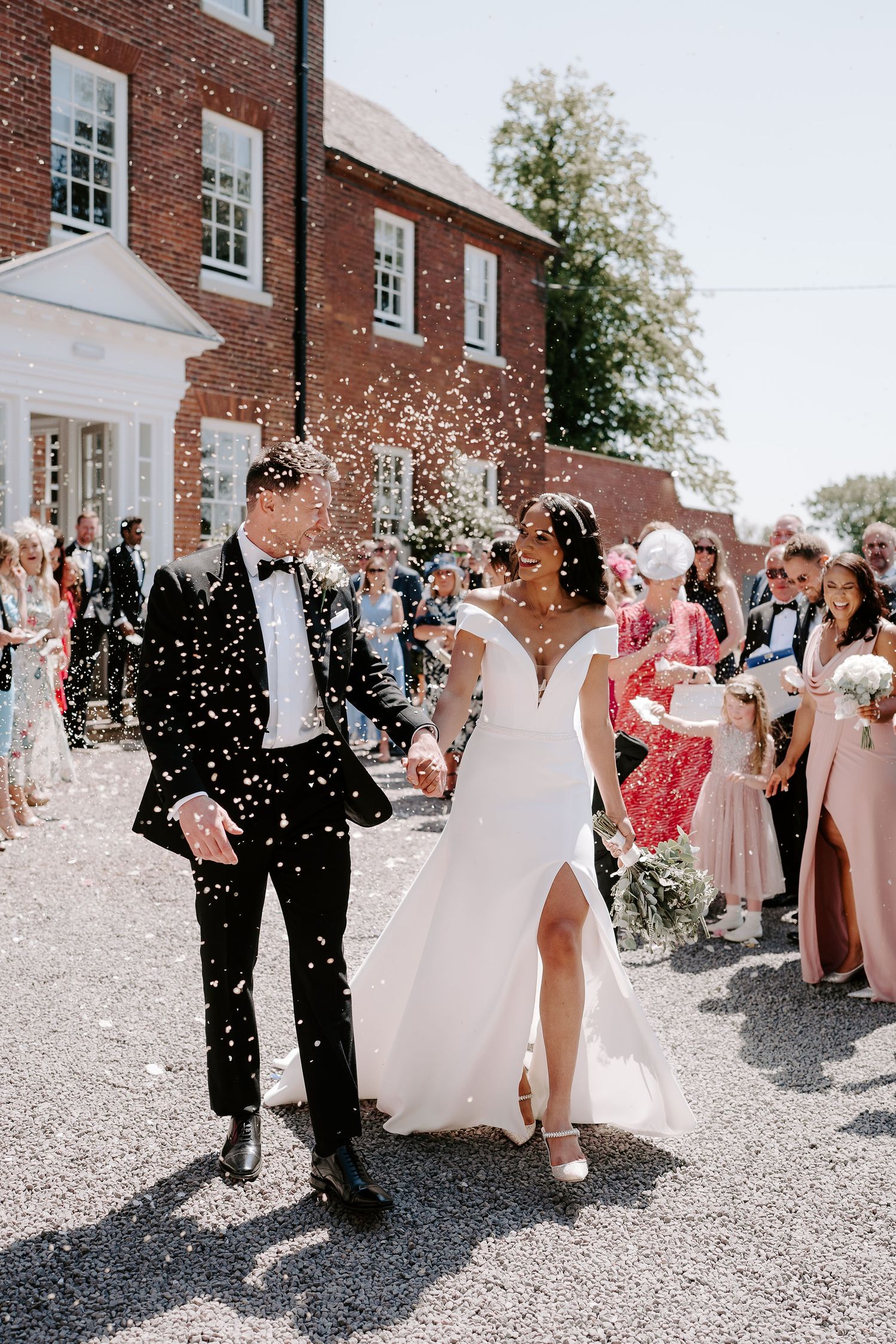bride-and-groom-confetti-stockton-house-wedding-shropshire