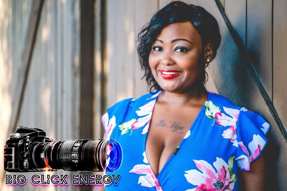 Beautiful black model with curly, dark, natural hair. Outdoors. floral dress, red lipstick, AZ, phoenix