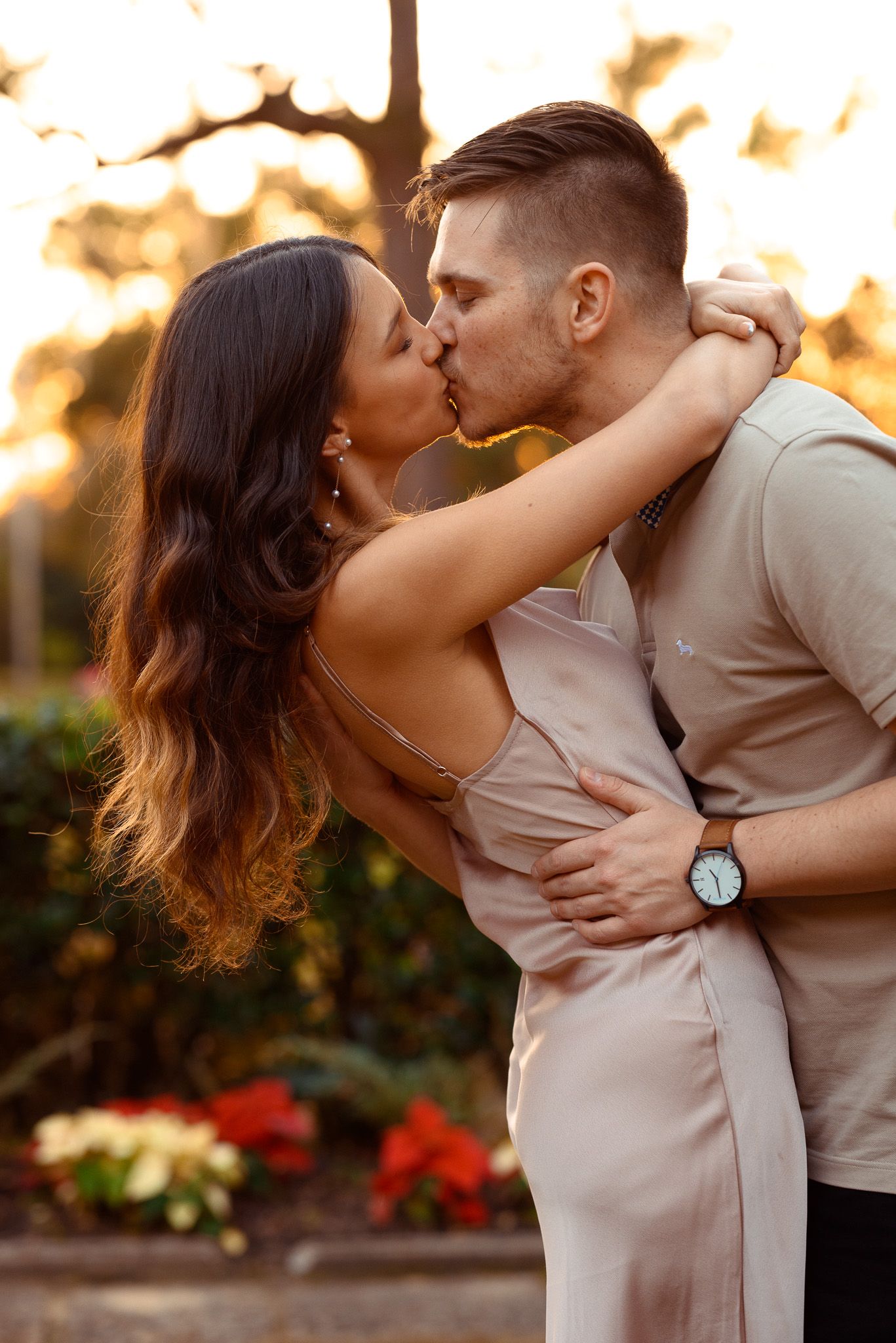 Noah and LaTrenda sharing a romantic sunset kiss during couples portraits at Bok Tower Gardens in Lake Wales, Florida.