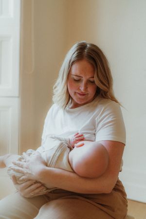 Intimate indoor lifestyle photography session capturing quiet moments in soft natural light.