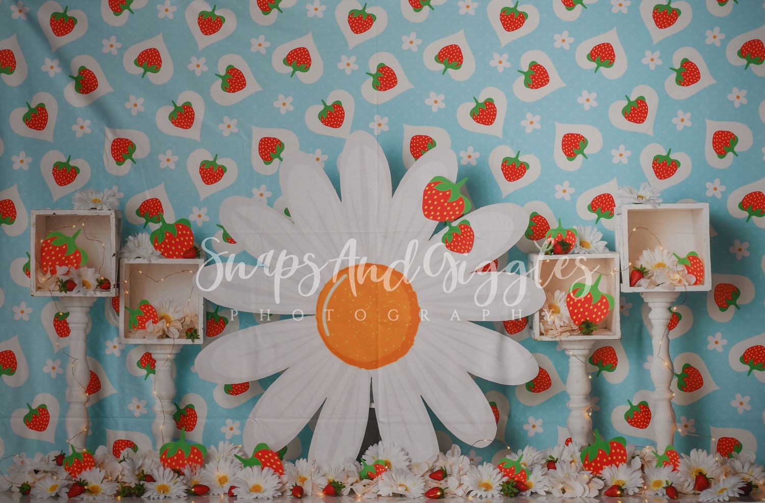 Blue background pattern with white daisies and red strawberries in repeating design.
