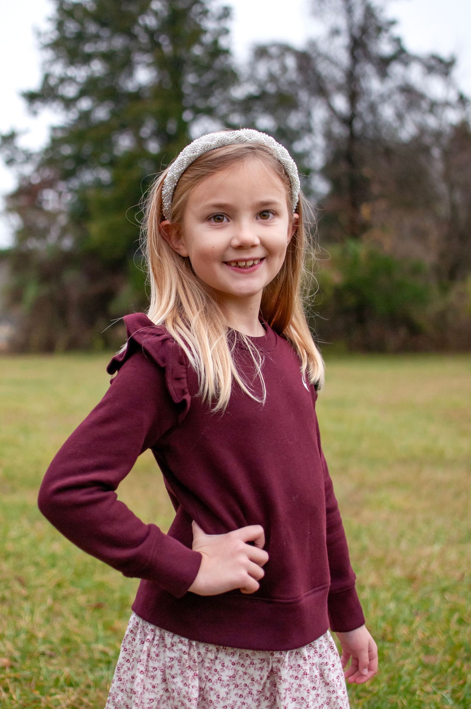 Pose of young girl smiling standing