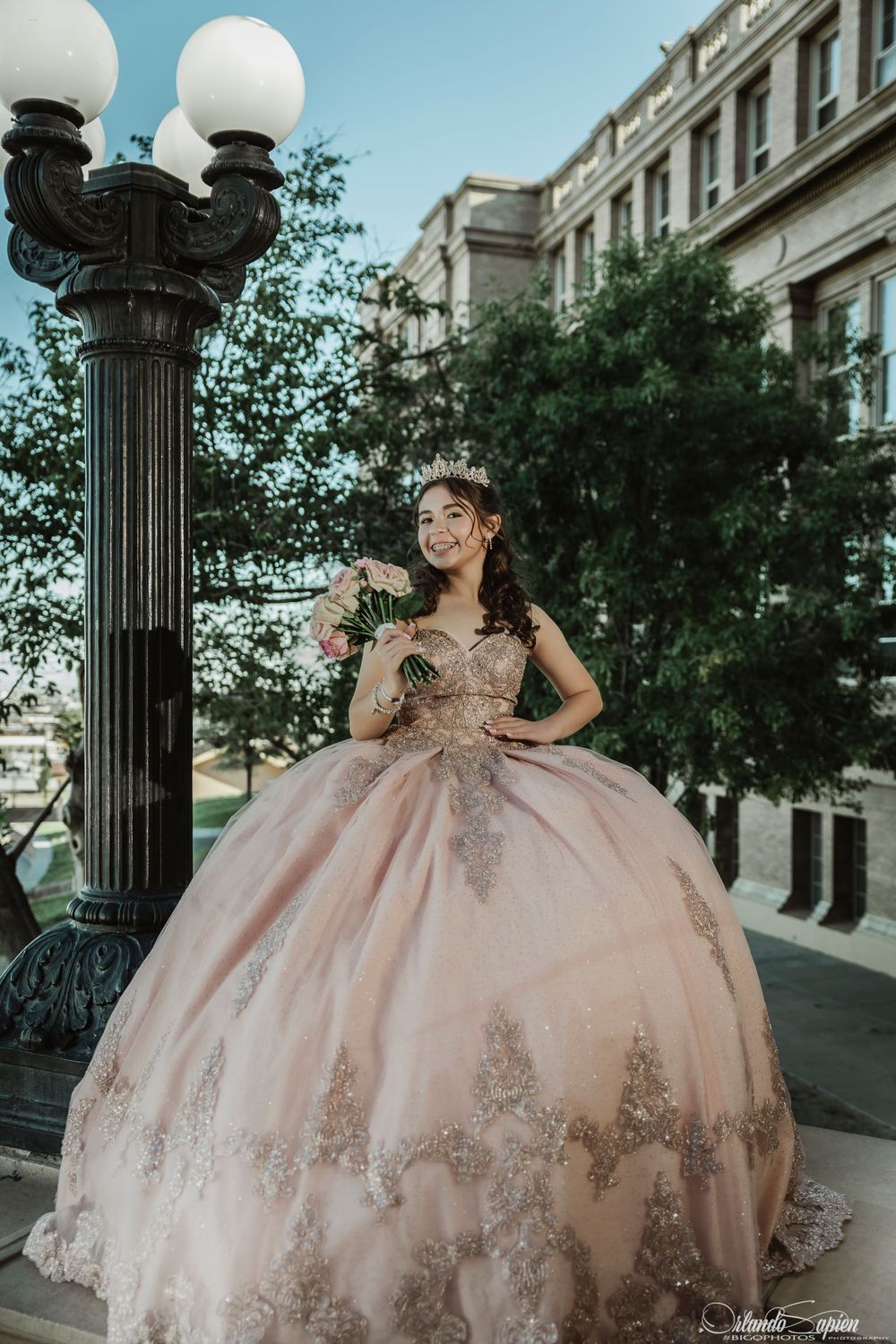 Blush pink ball gown with sparkly details photographed by vintage street lamp.