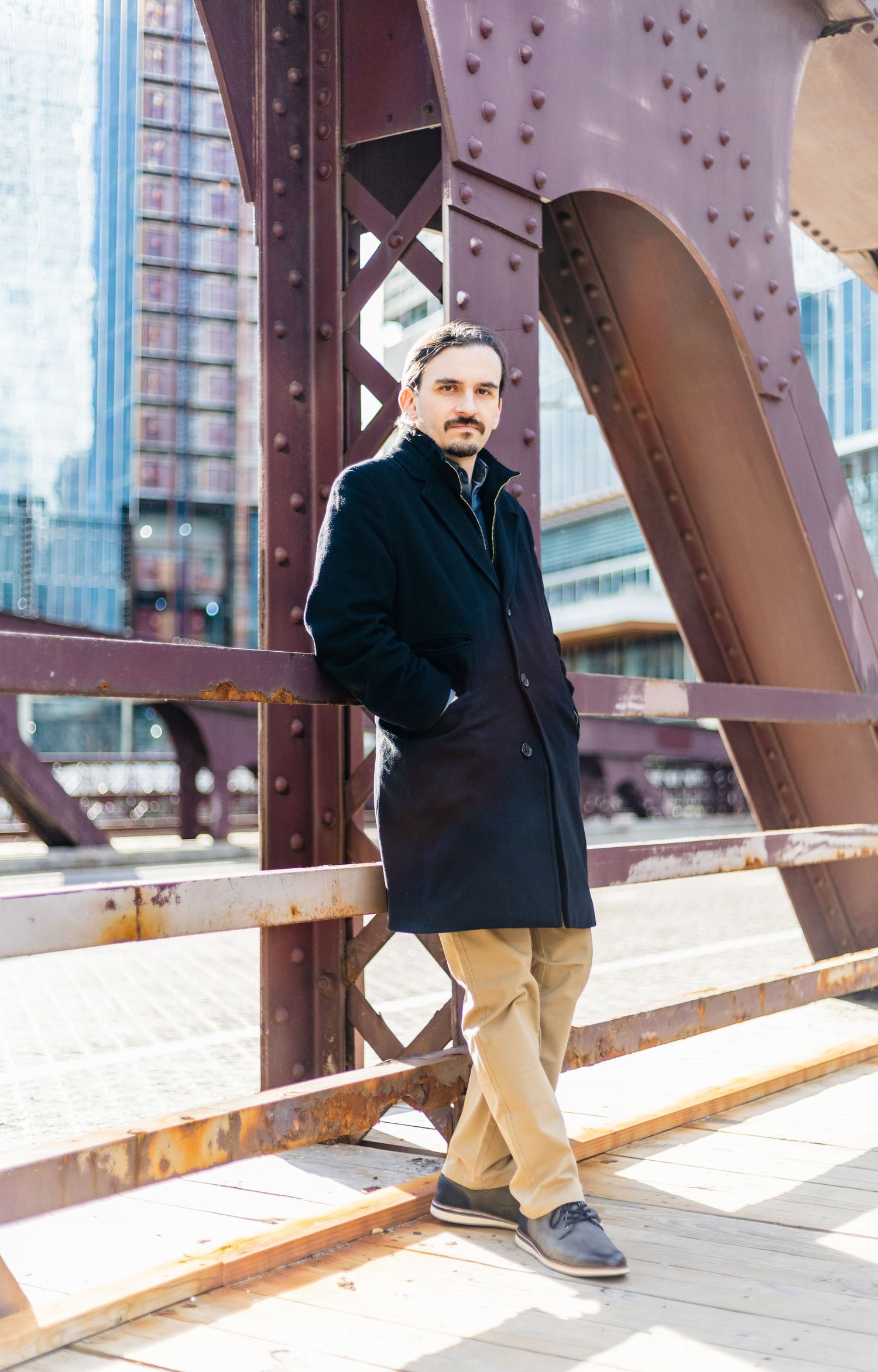engineer standing on bridge in chicago by CLW Photography