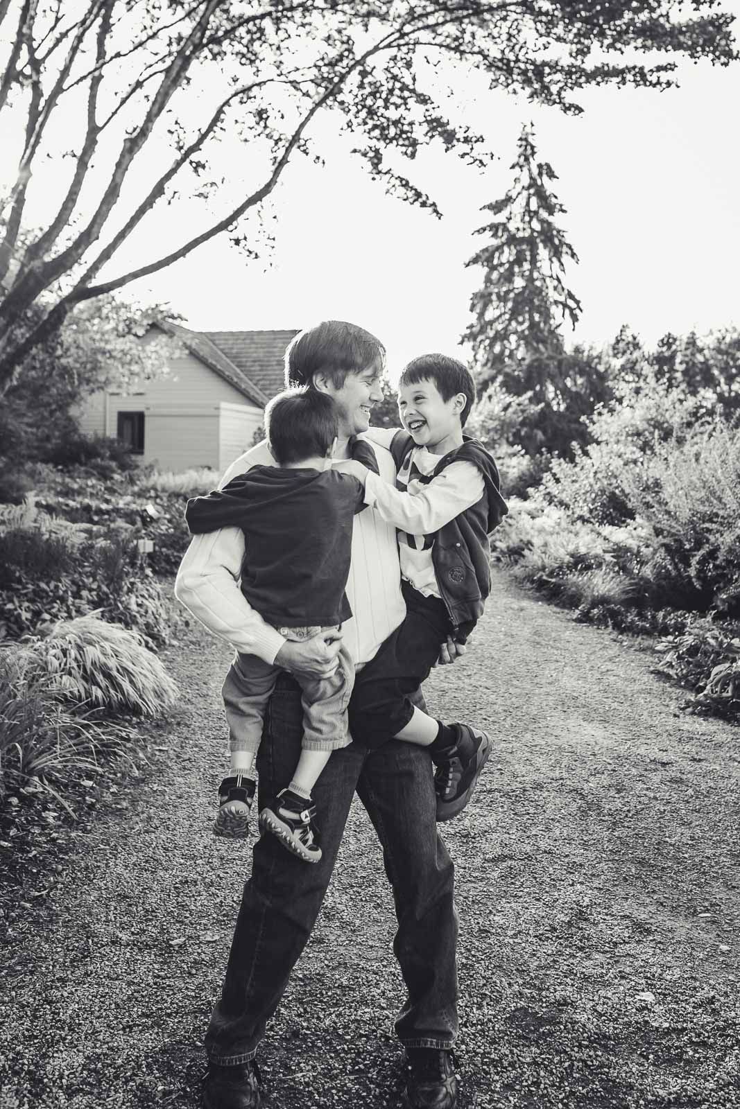 Black and white image of father with his sons in Bellevue