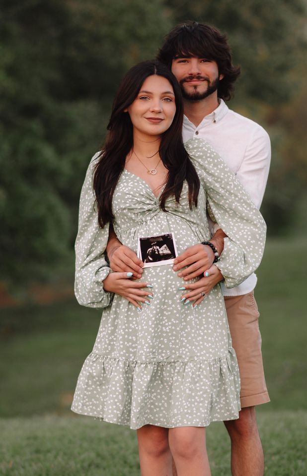 Picnic maternity photoshoot. Male sitting. Female laying down . Unscripted posing