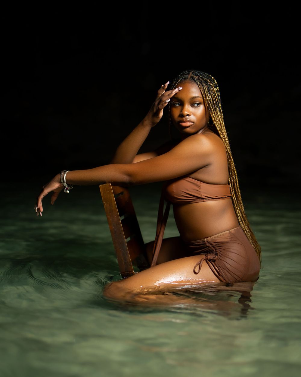 Beachside portrait of woman in brown swimsuit — luxury lifestyle photo by Timoy B Photography in Antigua.