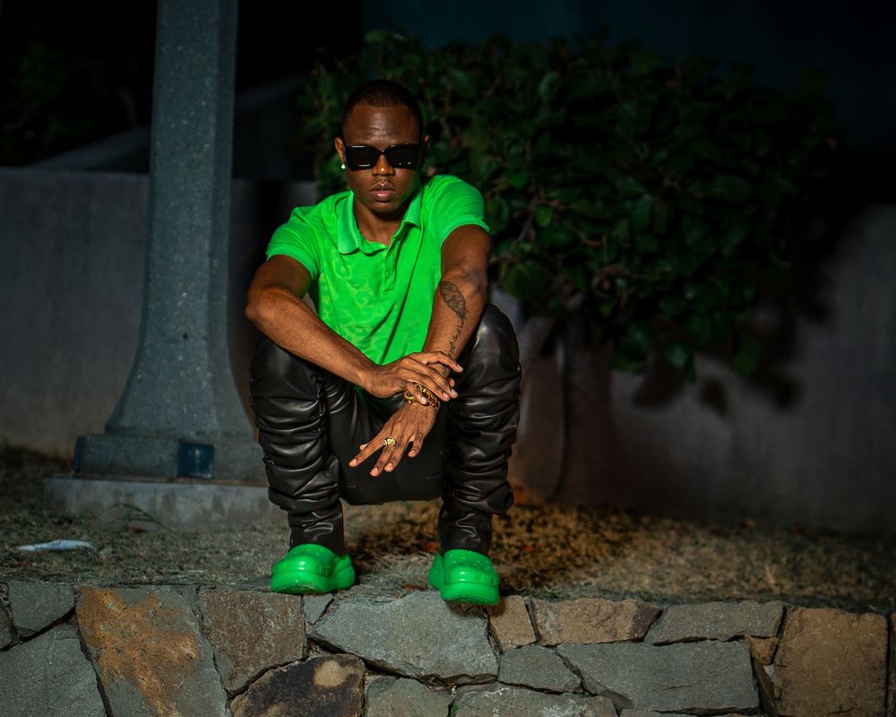 Night portrait of man in green outfit — urban fashion photo by Timoy B Photography.