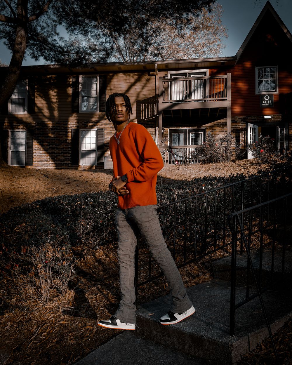 Street portrait of man in orange jacket — creative editorial by Timoy B Photography in New York.