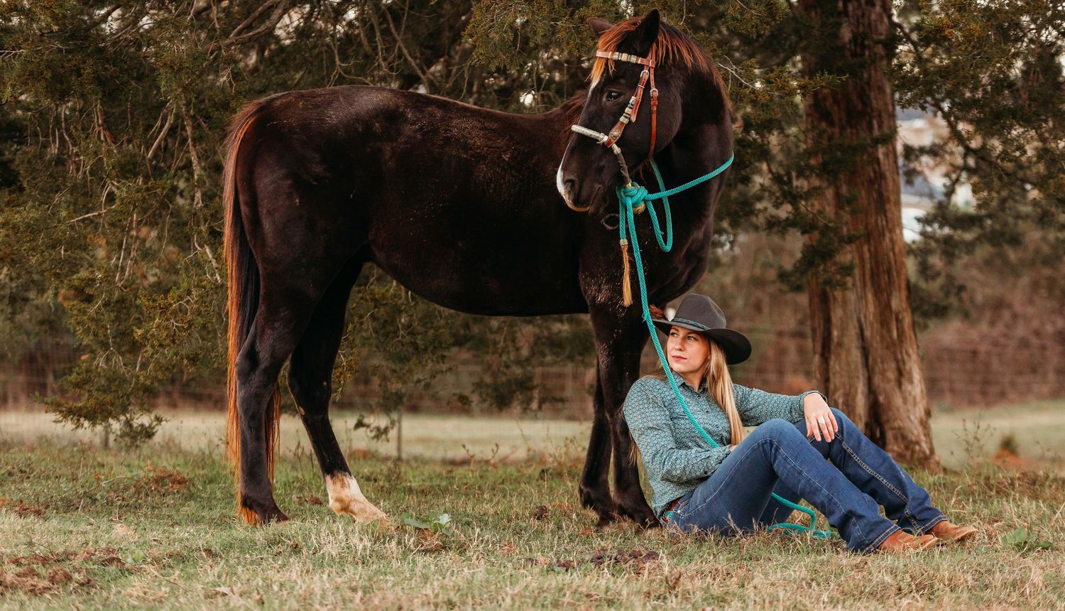 Lady with her horse sitting on the ground. Greenville sc newborn photographer, Easley sc newborn photographer, Upstate sc newborn photograph