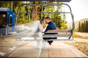Artistic wedding photos taken at a park with playful poses and natural lighting.