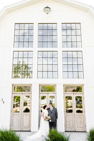 Classic white chapel facade with large windows and elegant entrance.