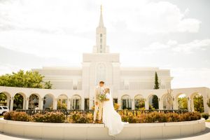 Beautiful white temple building with spires photographed in panoramic view.