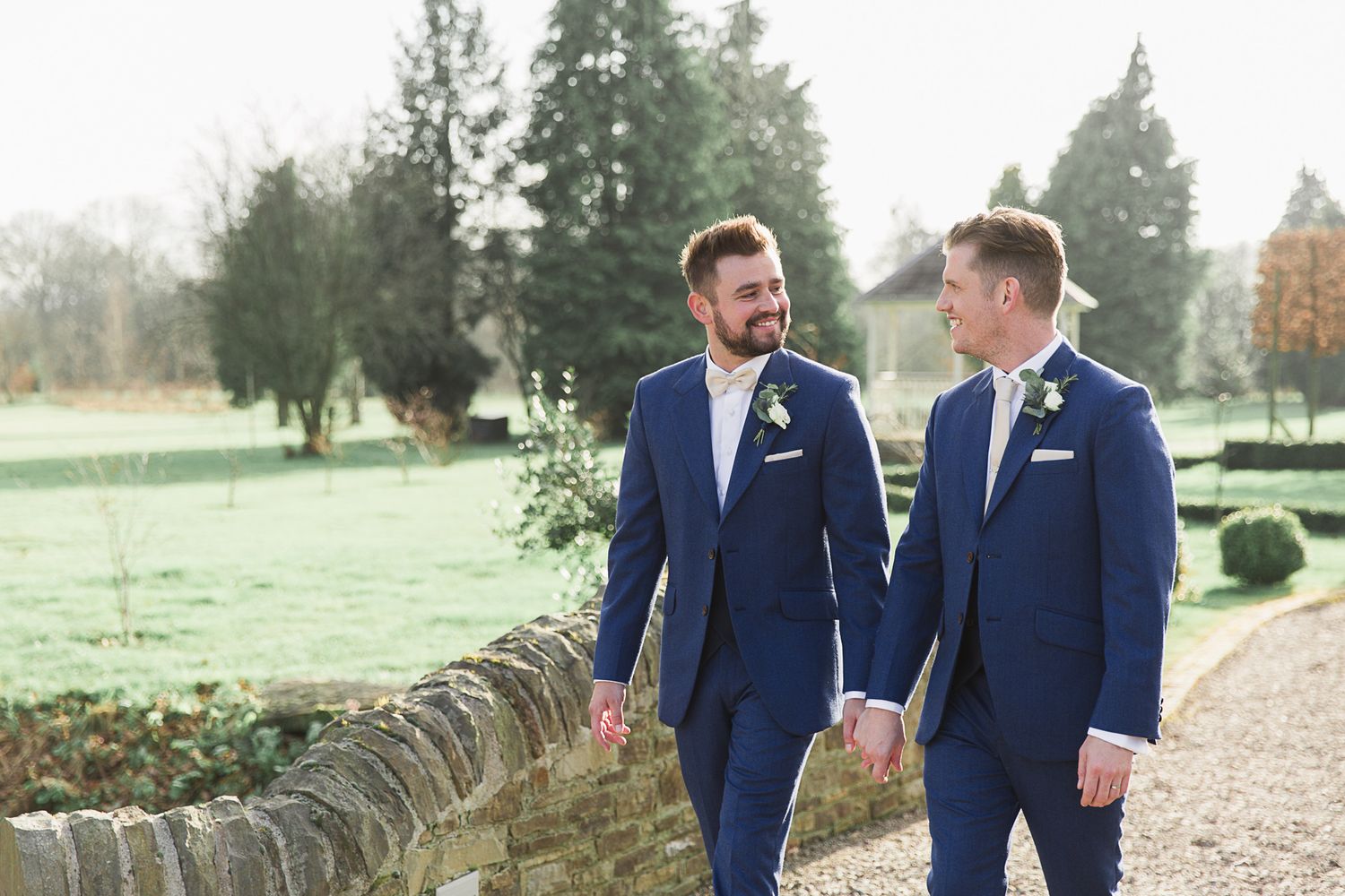 Hayley Elizabeth Photography - Wedding photographer lemore manor Herefordshire West Midlands two grooms walking