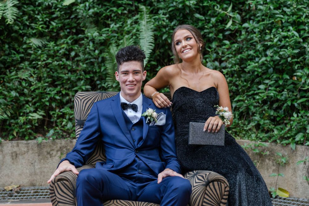 A couple of HIGHSCHOOL seniors before attending HIGHSCHOOL formal together.