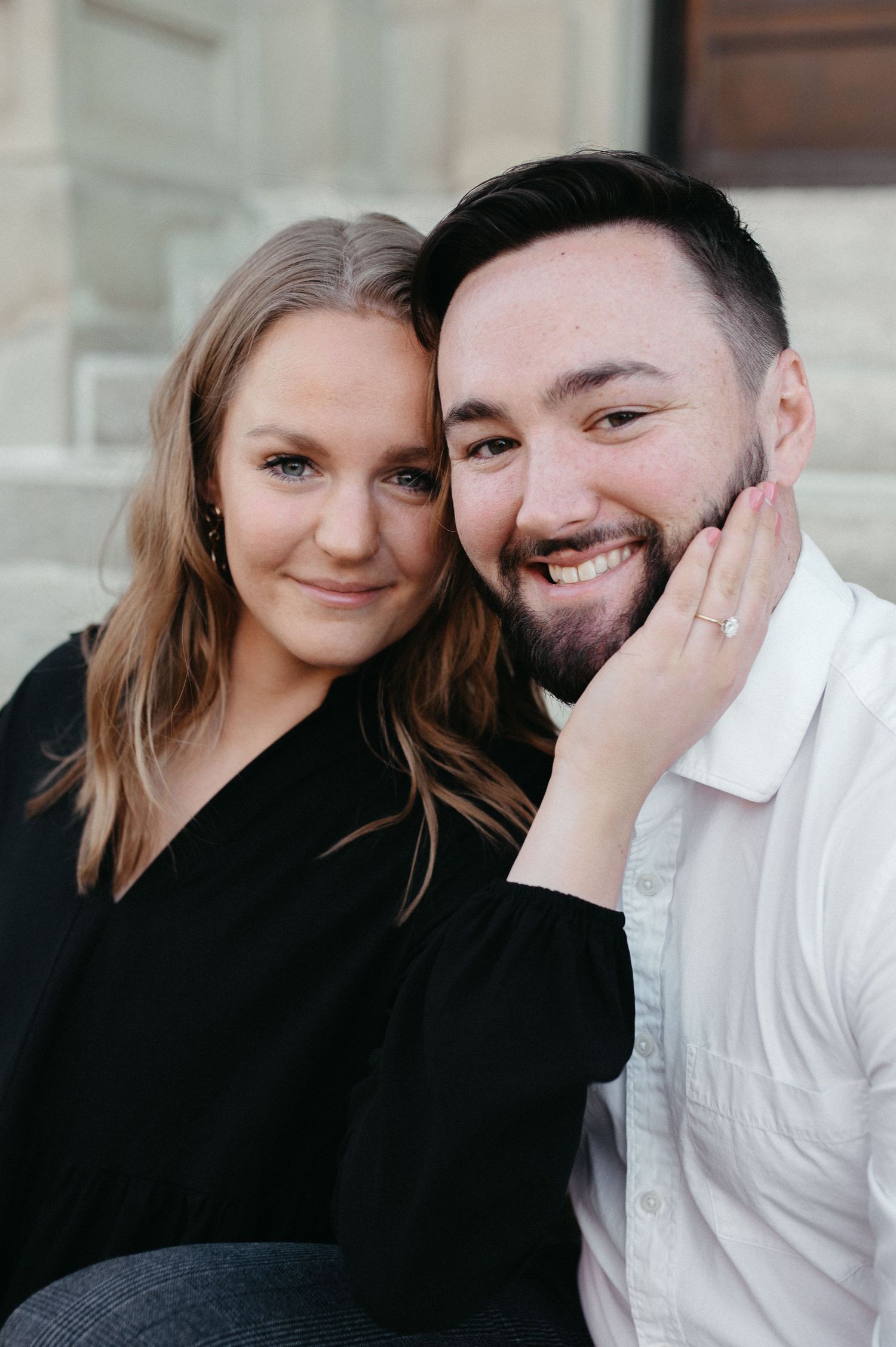 An intimate portrait of a couple sharing a tender moment during their engagement photoshoot.