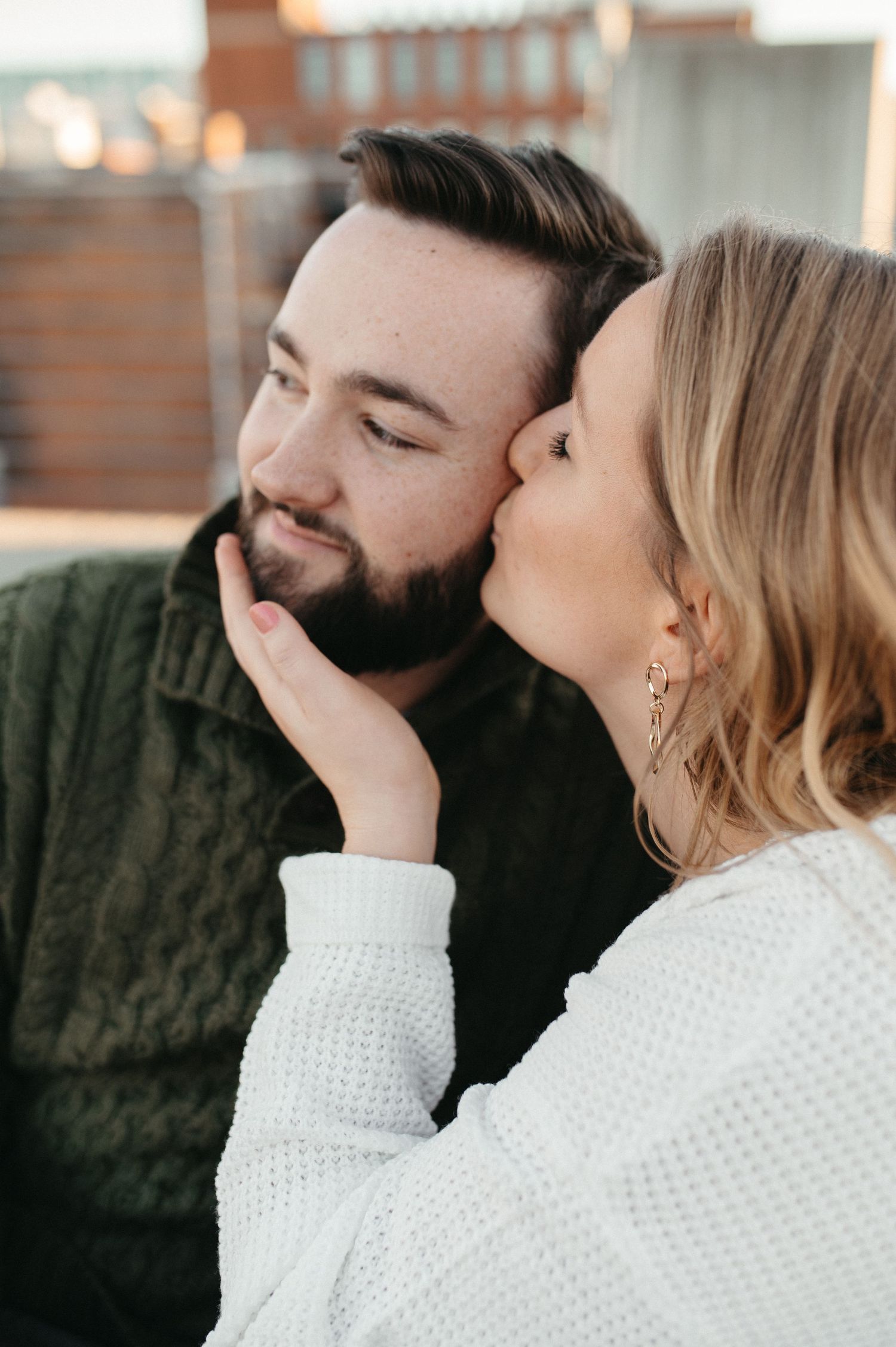 Intimate moment between couple during golden hour photo session.
