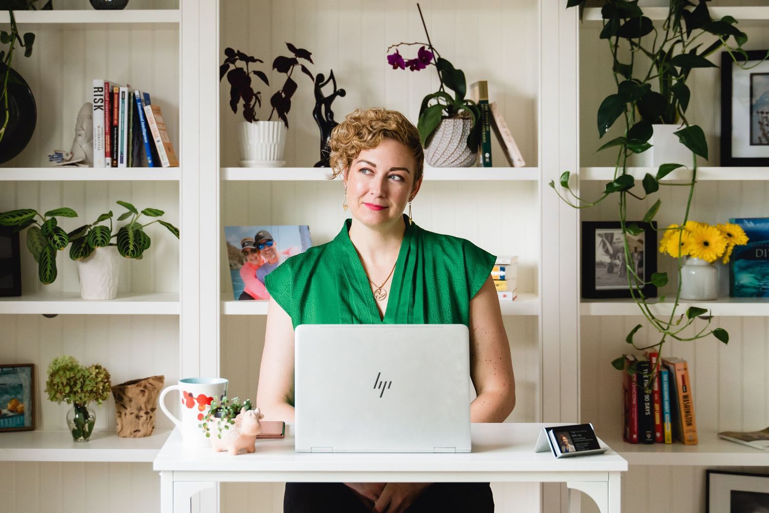 female financial advisor looking confident in personal branding image at desk
