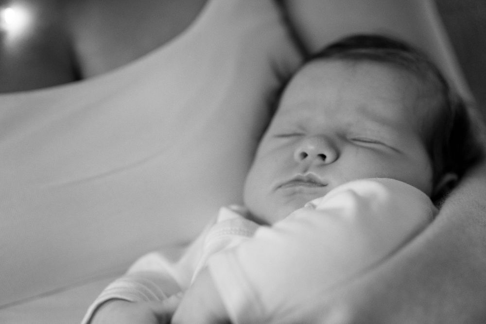 Newborn in the mother's arms.