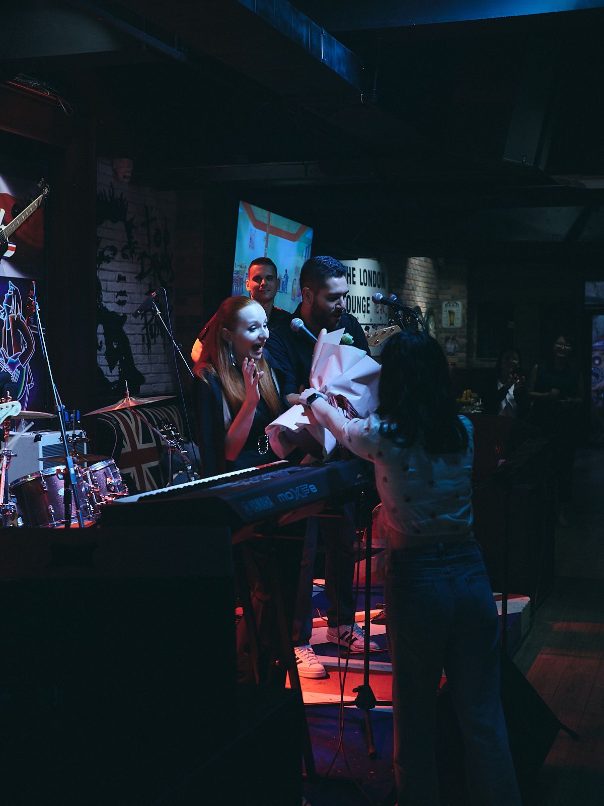 no borders band member receiving flowers from a fan at zhuhai london lounge