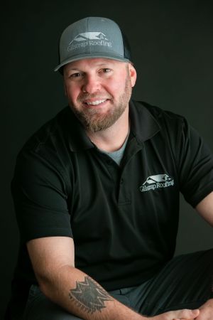 A casual headshot of a man sitting and smiling. Greenville SC Boudoir, Easley SC Boudoir, Upstate SC boudoir