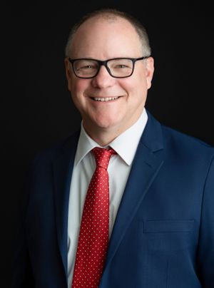 A corporate headshot with male wearing a suit and tie. Greenville SC Boudoir, Easley SC Boudoir, Upstate SC boudoir