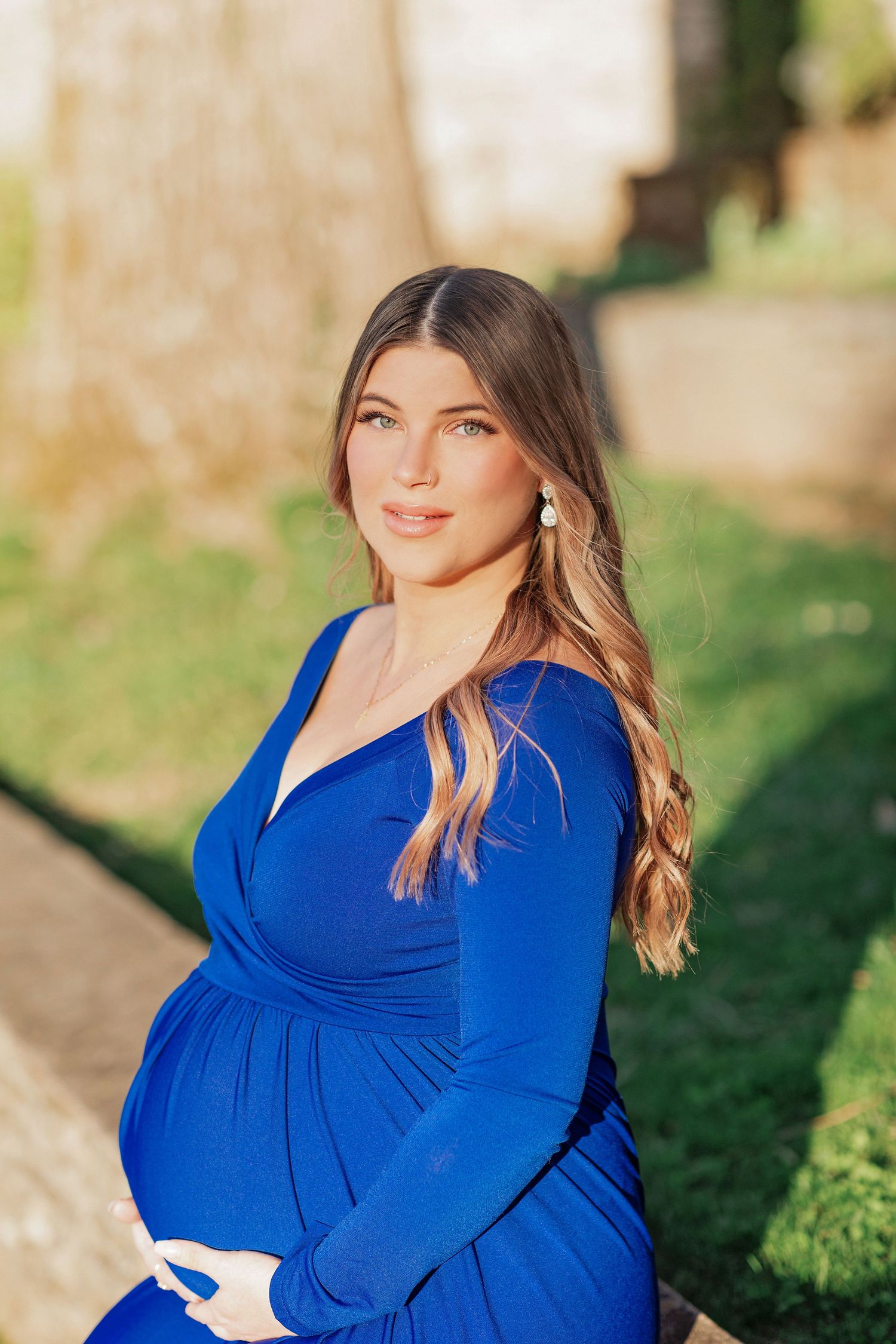 Elegant maternity session at Knoxville Botanical Garden and Arboretum, highlighting an expectant mother's radiant glow i