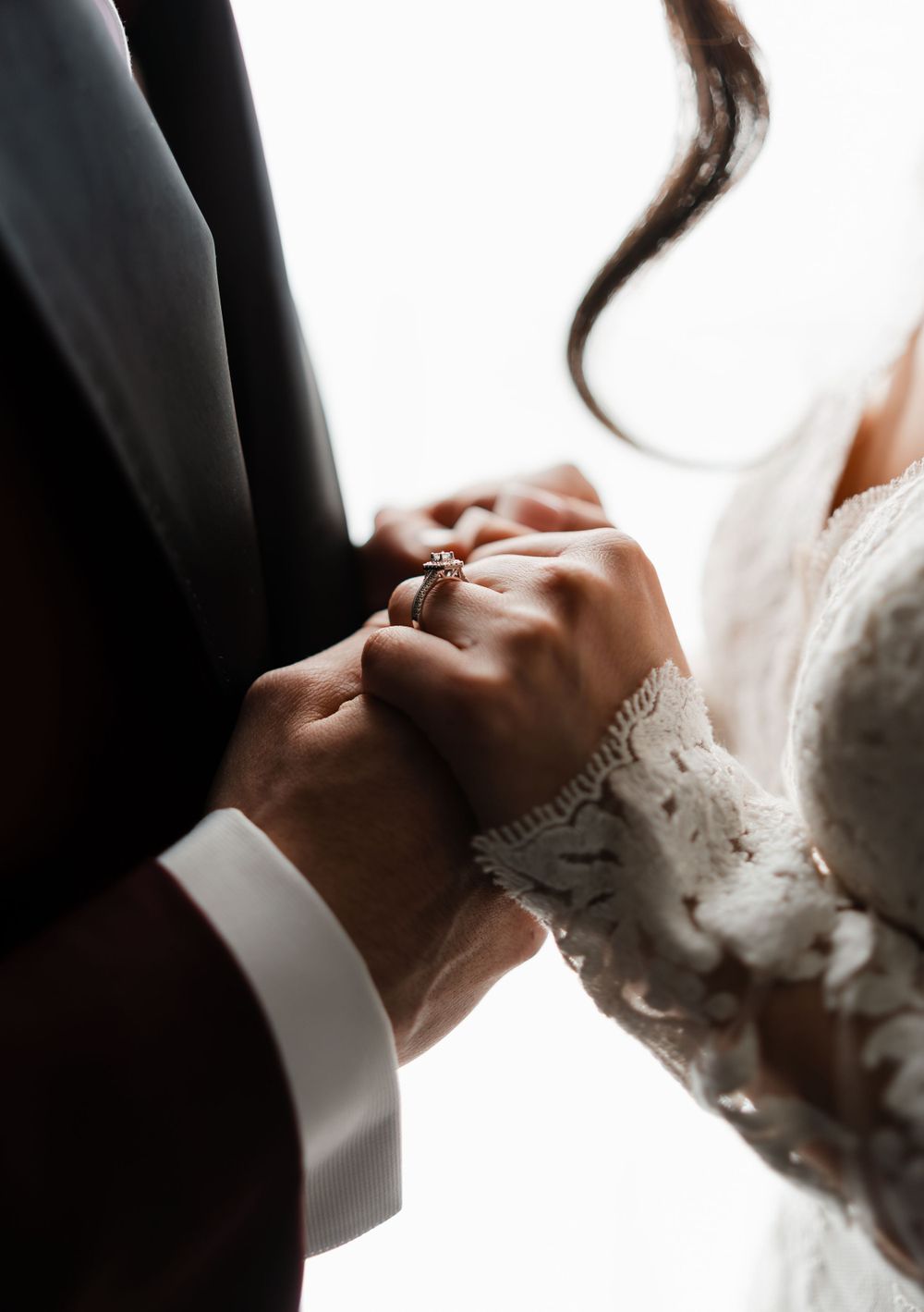 Artistic black and white portrait capturing intimate wedding moment.