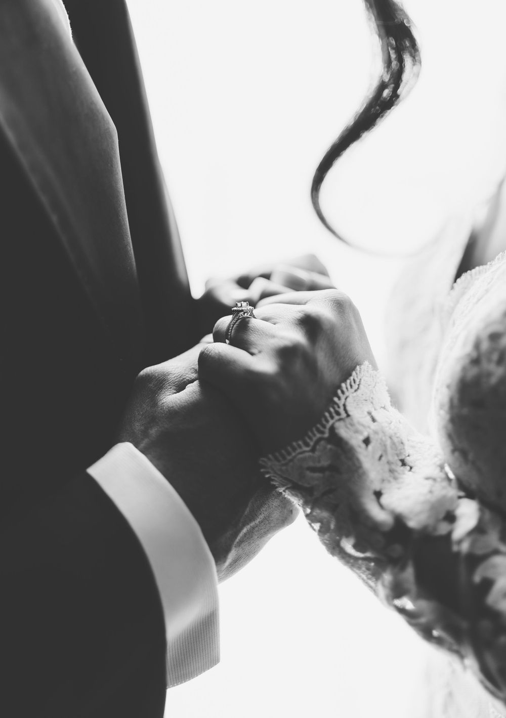Romantic black and white close-up of couple sharing tender moment.