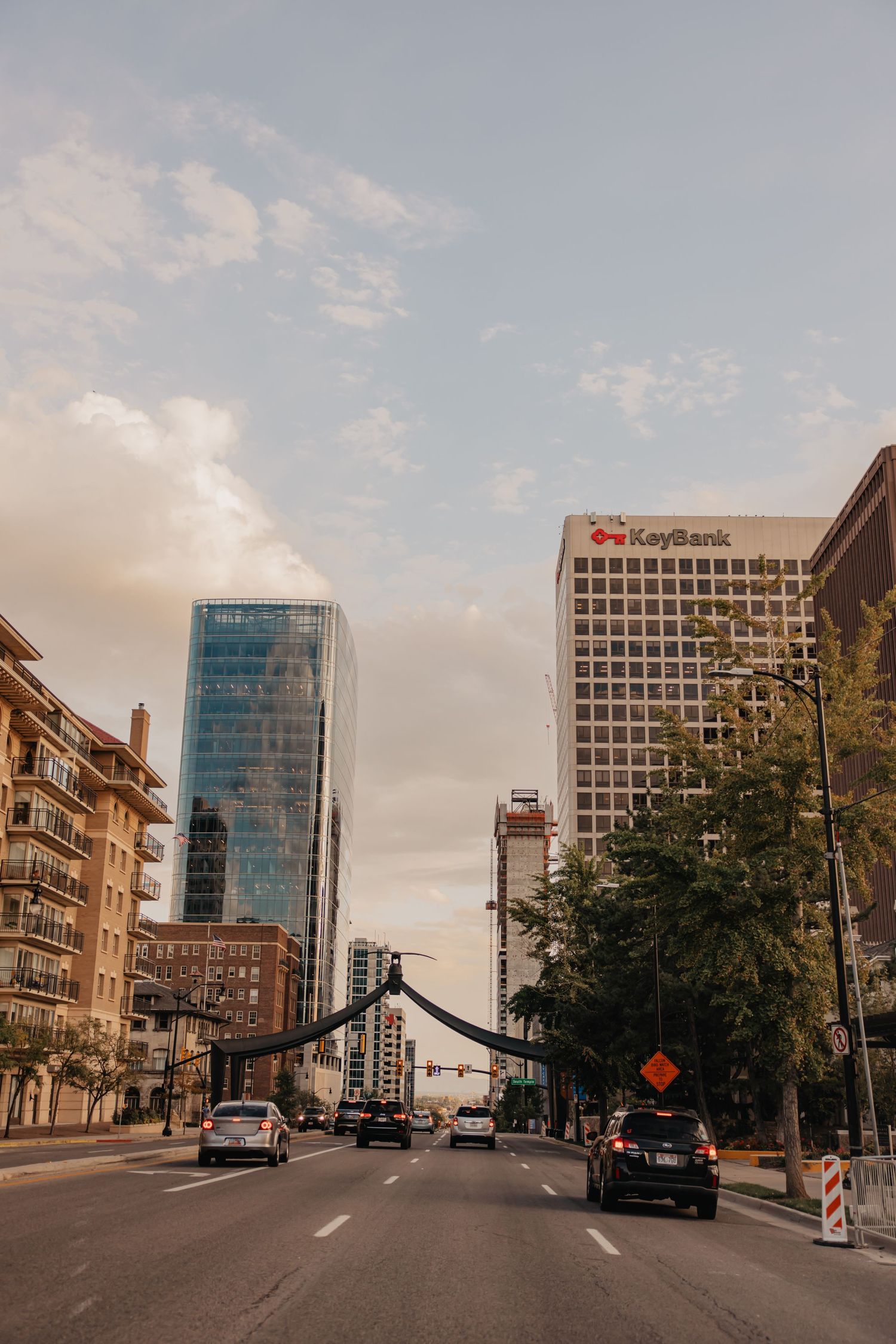 Downtown cityscape with modern office buildings and streets at golden hour.