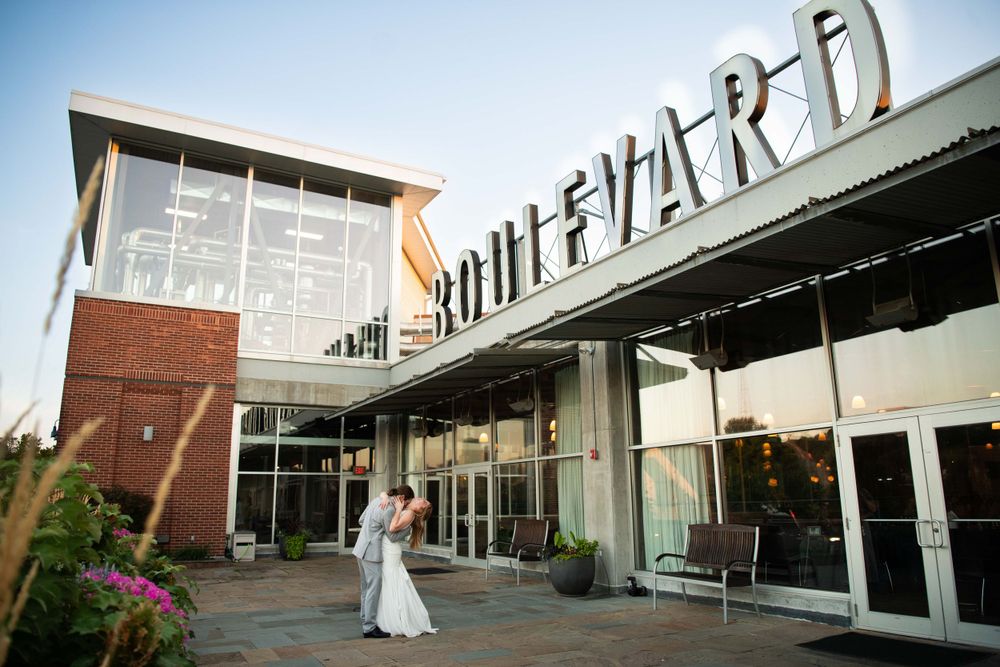 Modern Boulevard shopping center exterior with wedding photo session at sunset.
