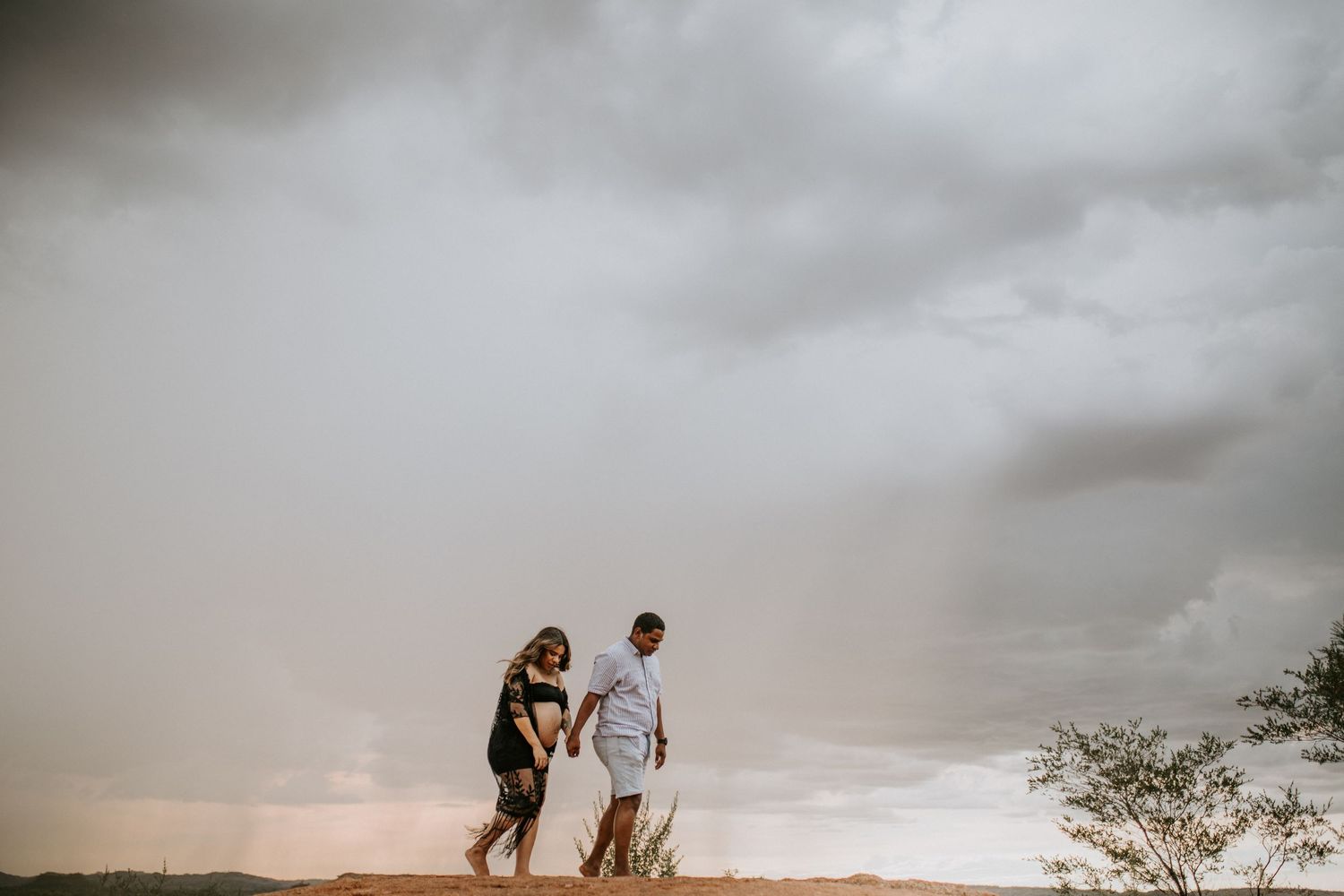 Couple with rainclouds in background