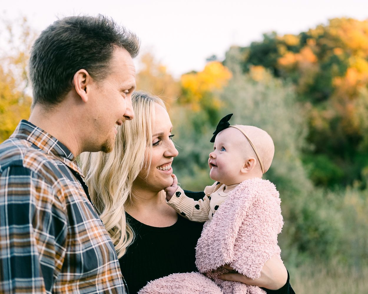 baby and parents at Kay's creek in Layton utah for fall family pictures.