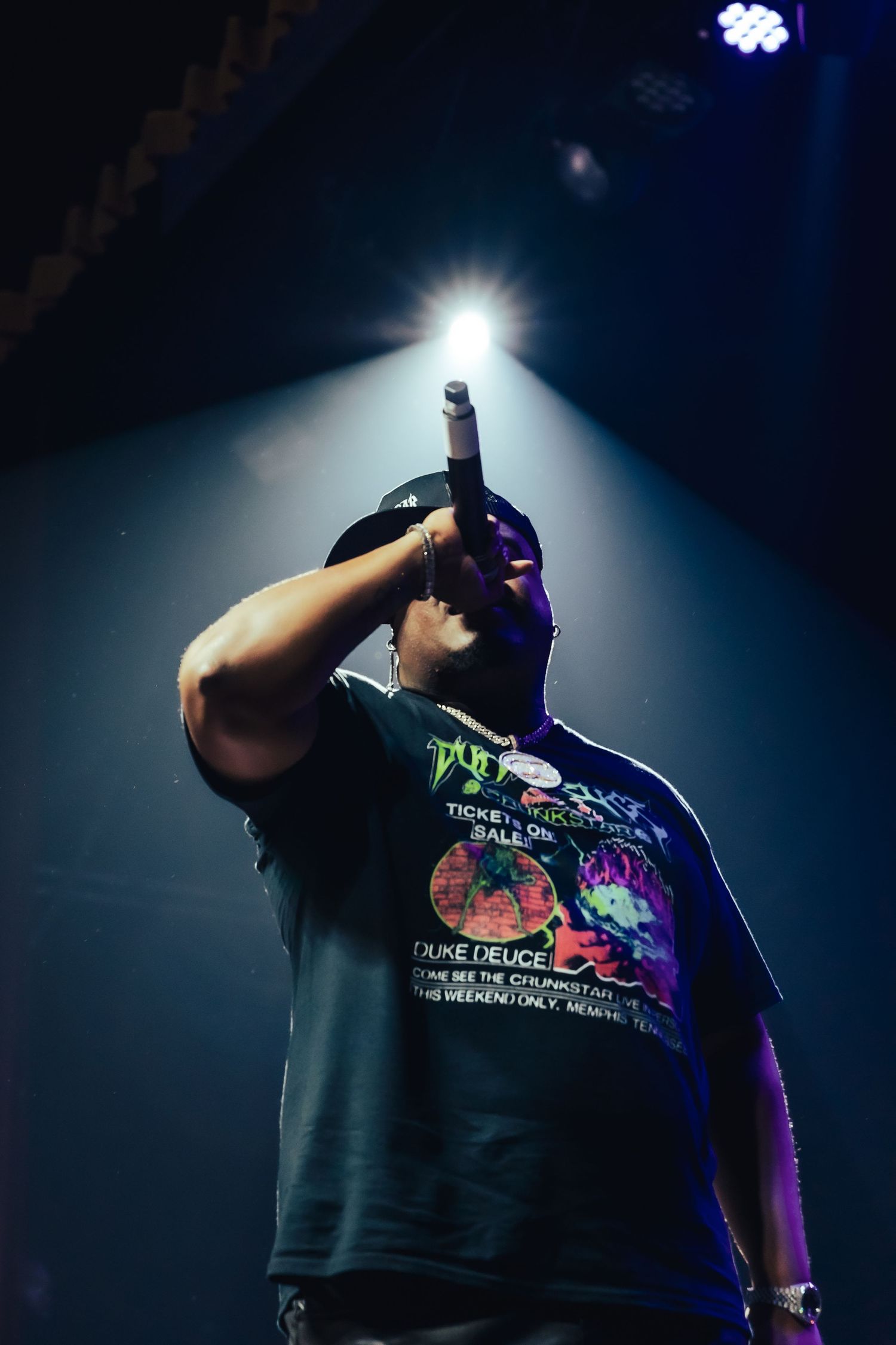 Close-up of rapper performing at music festival
