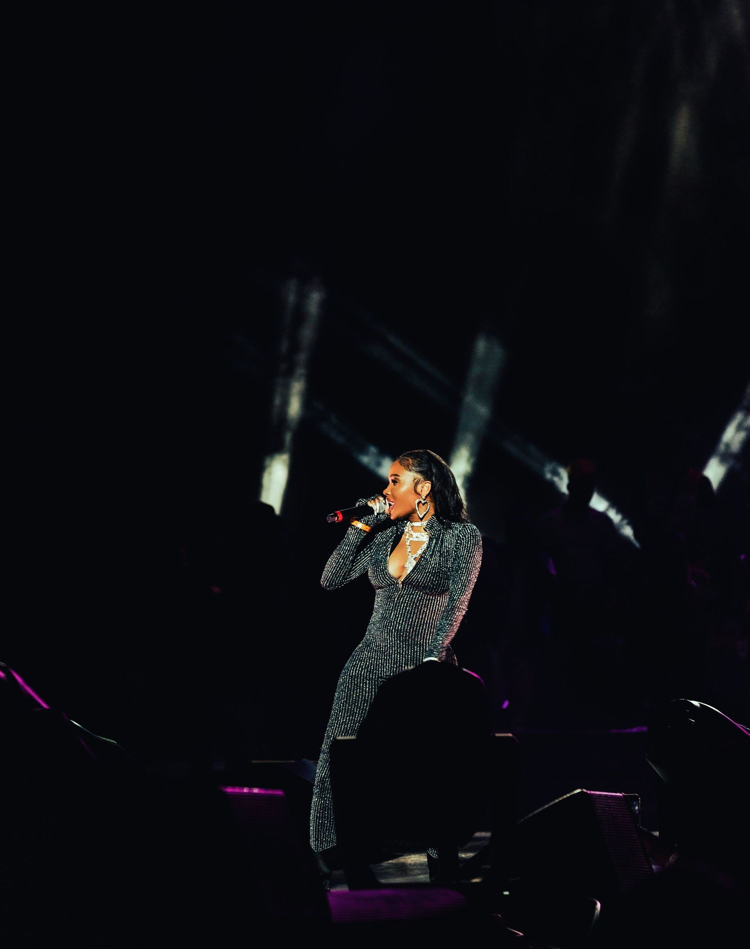 Side profile of rapper with microphone