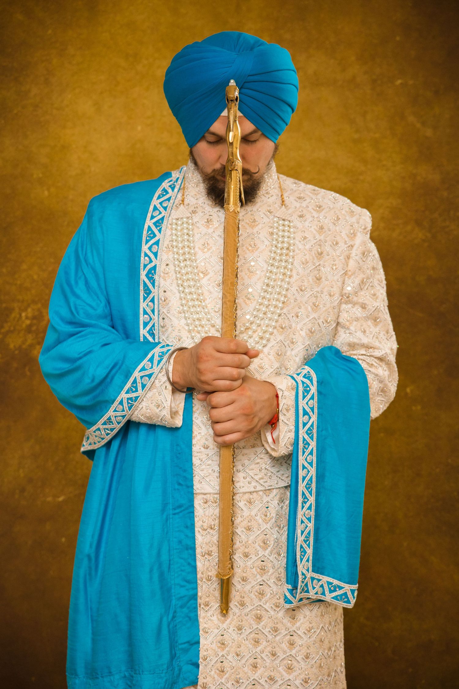 Sikh Groom holding Kirpan