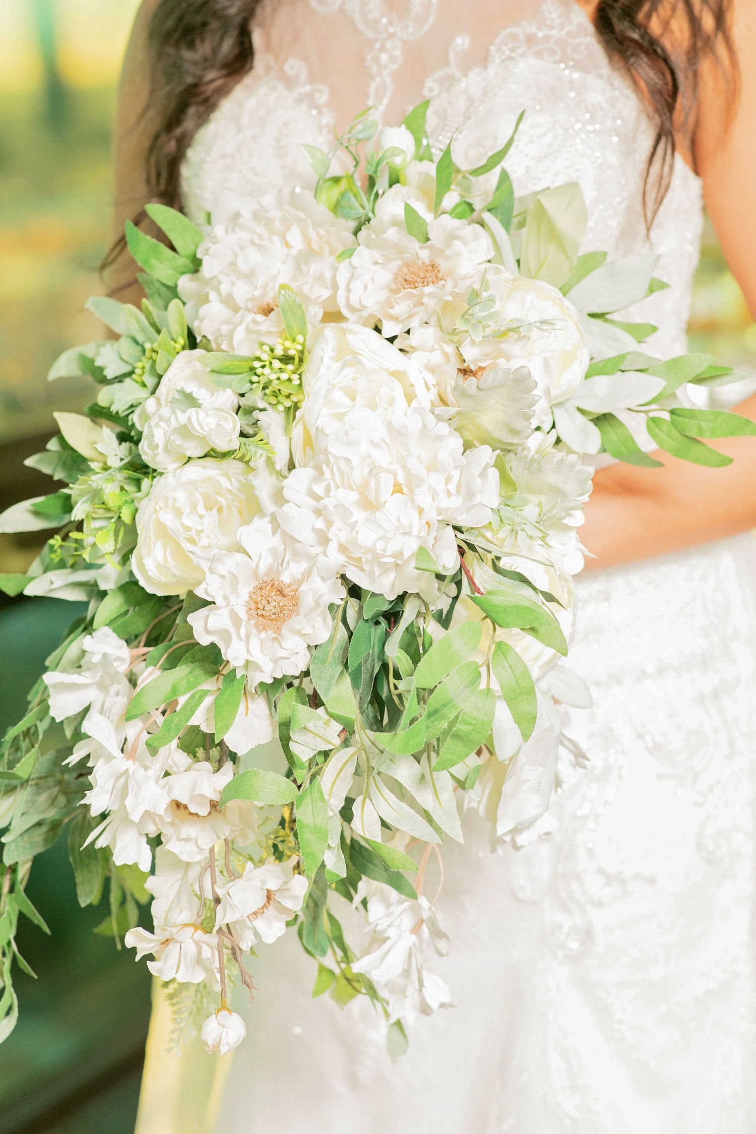 bride in white dress with flowers