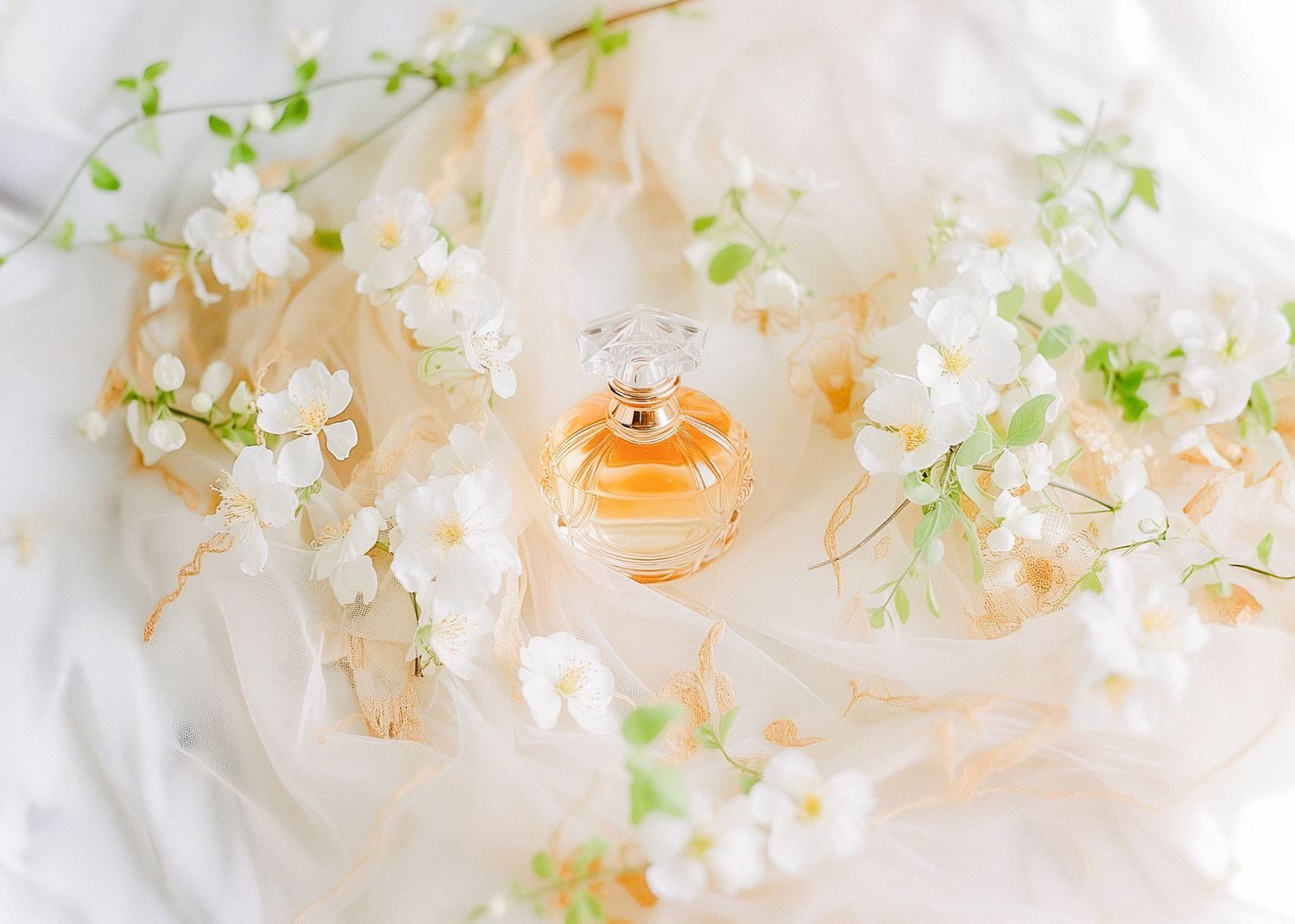 white flowers on bed photo