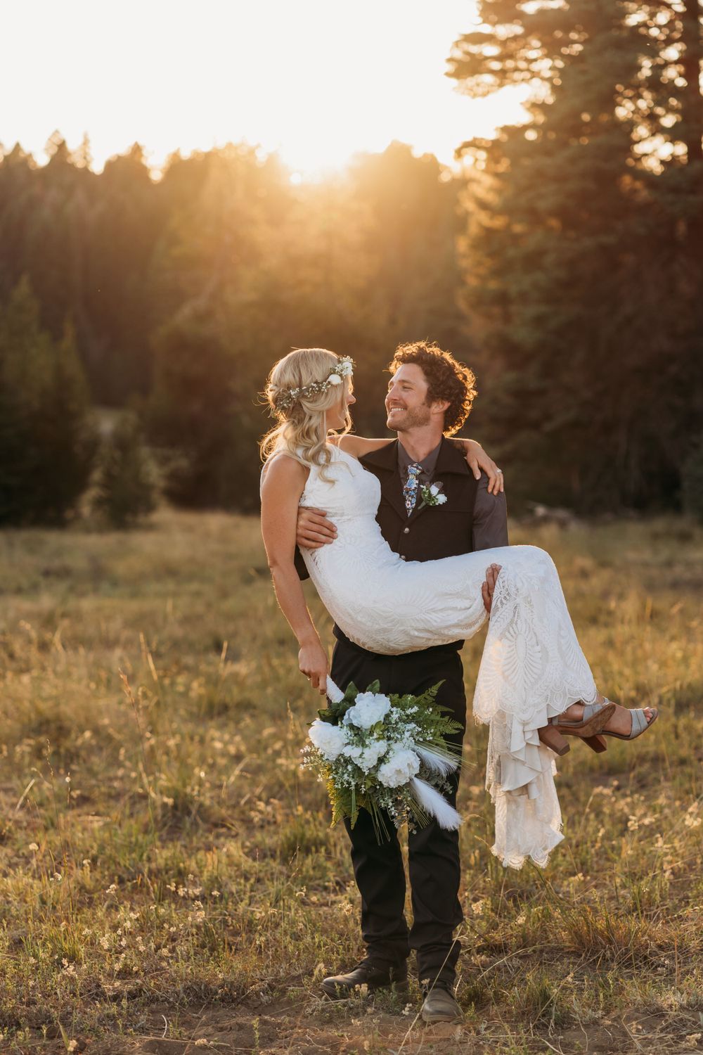 Romantic sunset moment in a mountain meadow with pine trees.