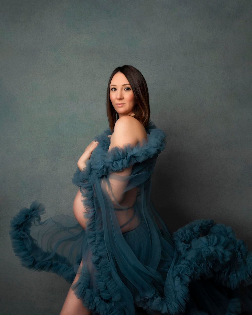 Maternity mum to be in a floating dress portrait photo