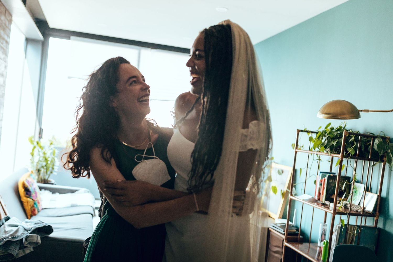 Happy moments captured in a bright room with exposed brick walls.