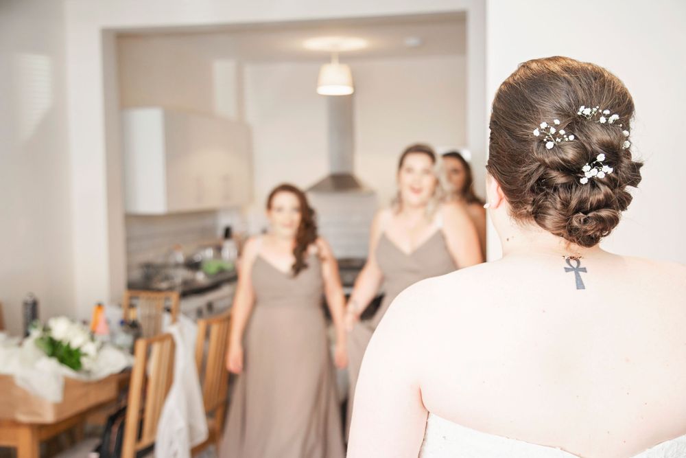 Bridesmaids seeing the bride for the first time