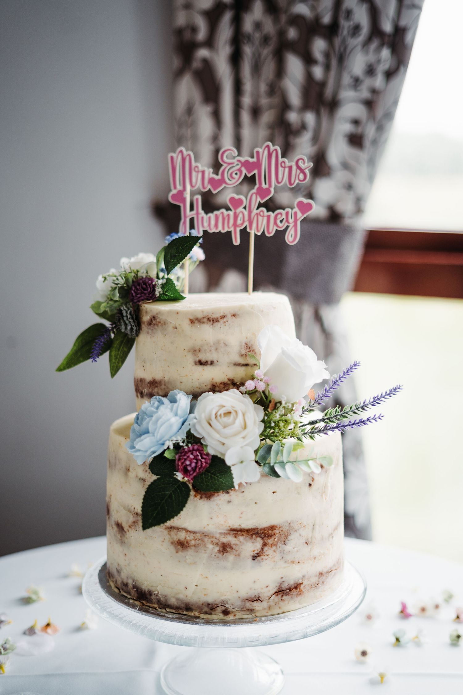 2 tier wedding cake with flowers, Belton Woods, Yorkshire wedding photographer, Emilia Czartnota