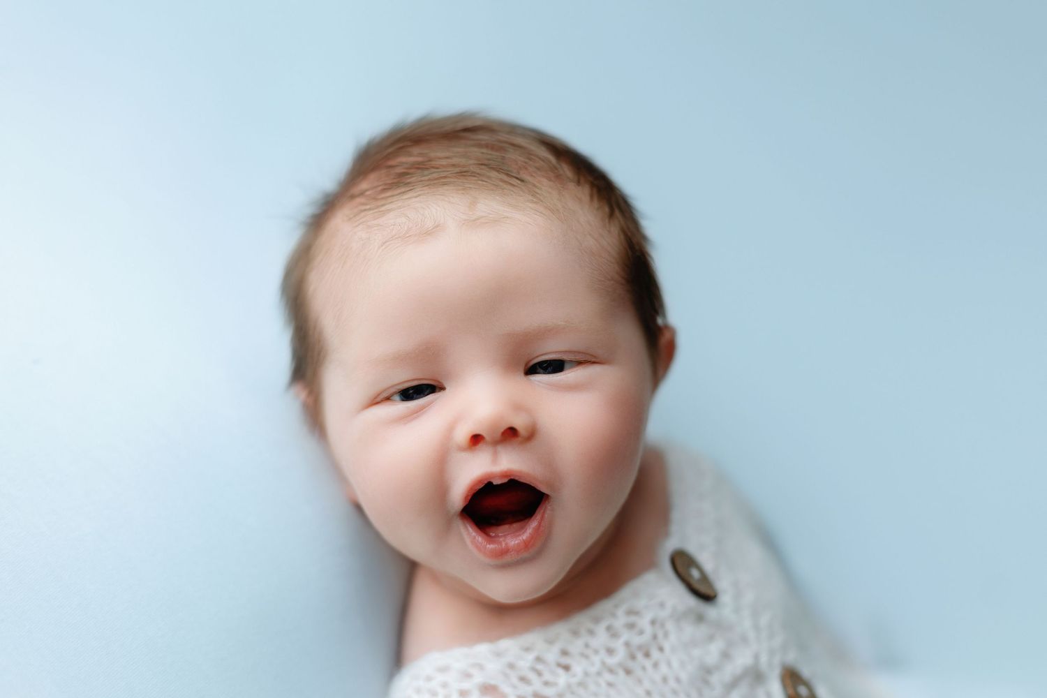 A newborn boy smiling and adorable. Greenville SC newborn photographer, Easley, SC newborn photographer, Upstate SC newborn