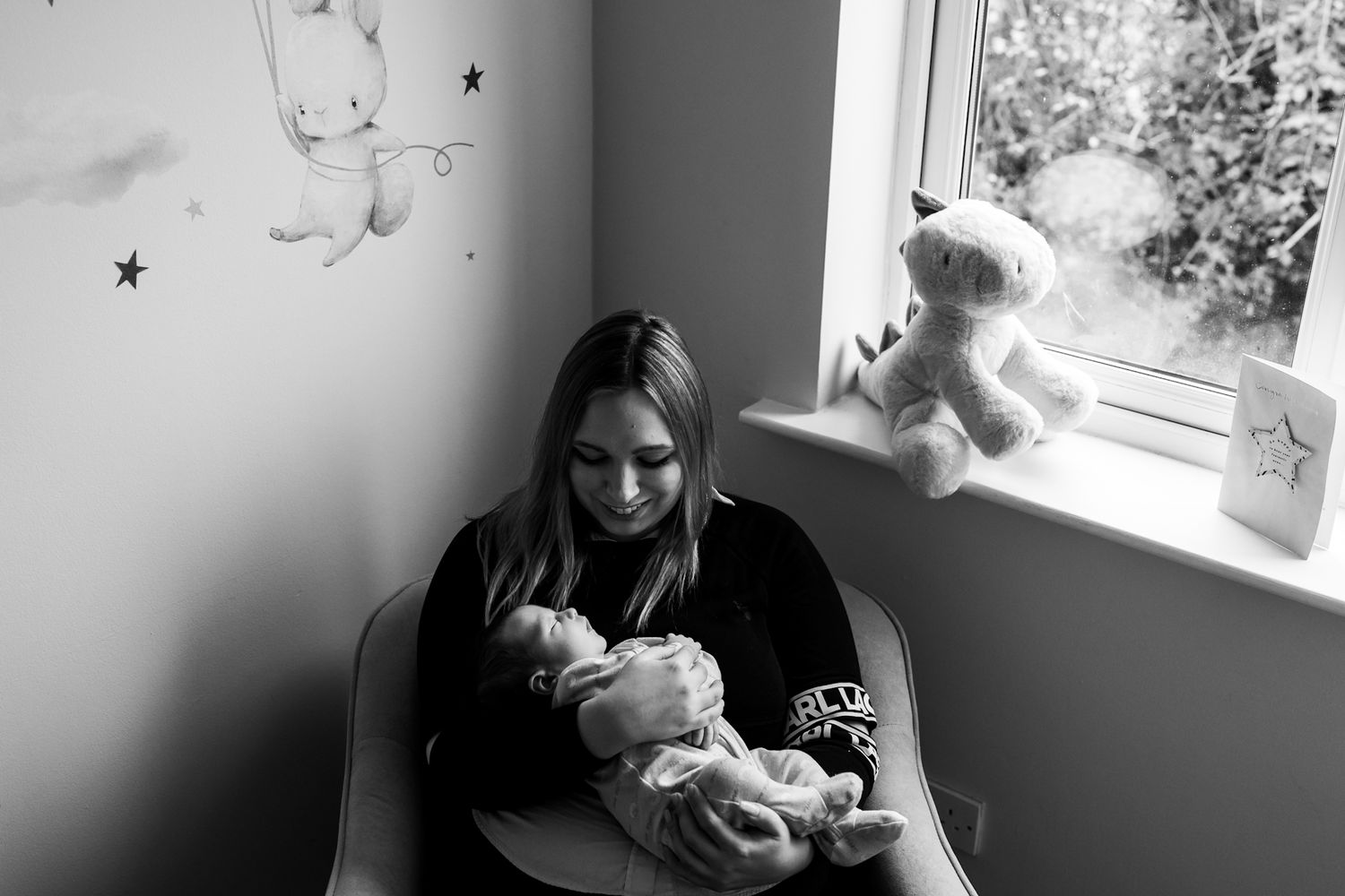 Mother-holding-her-baby-boy-newborn-photography