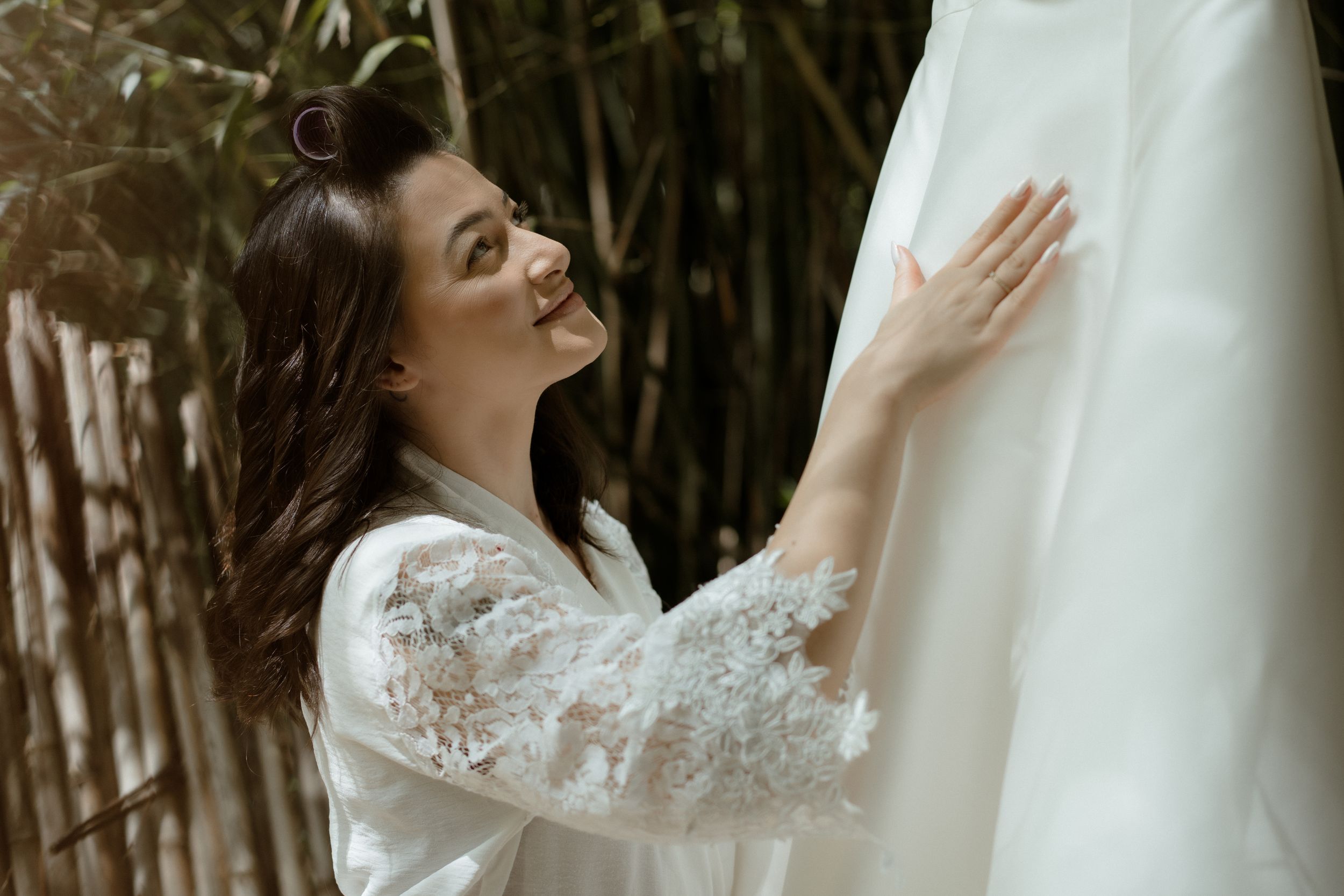 Delicate lace details on a white wedding dress.